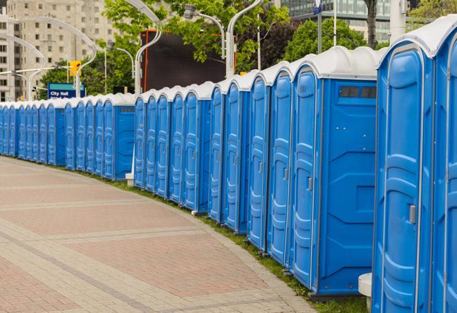 a line of portable restrooms set up for a wedding or special event, ensuring guests have access to comfortable and clean facilities throughout the duration of the celebration in Bremen, IN